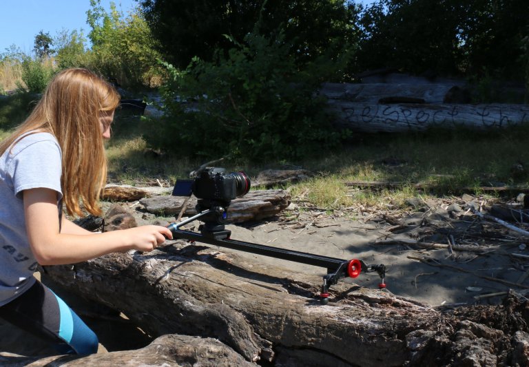 Girl making a movie outside