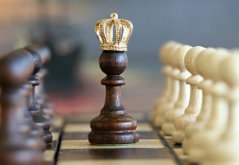 Chess board photo with a crowned pawn