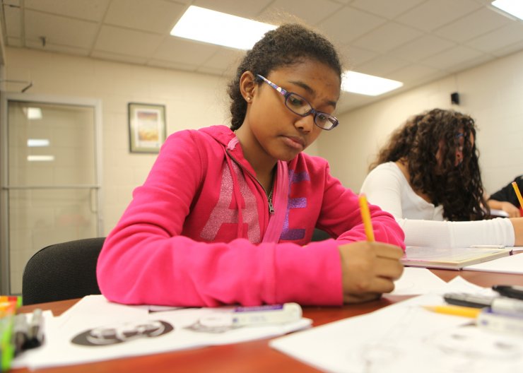 Comic Book & Improv Student working on a comic book panel in a Saturday Academy class