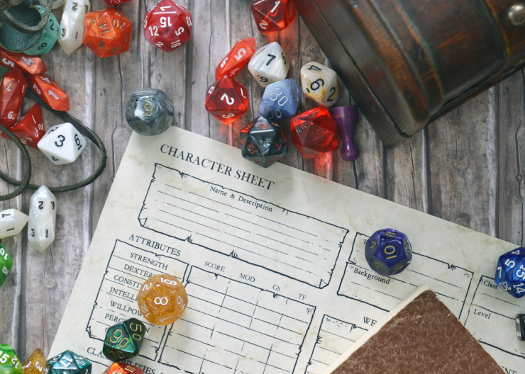 Role playing dice on a table with a character sheet, choose your own adventure!