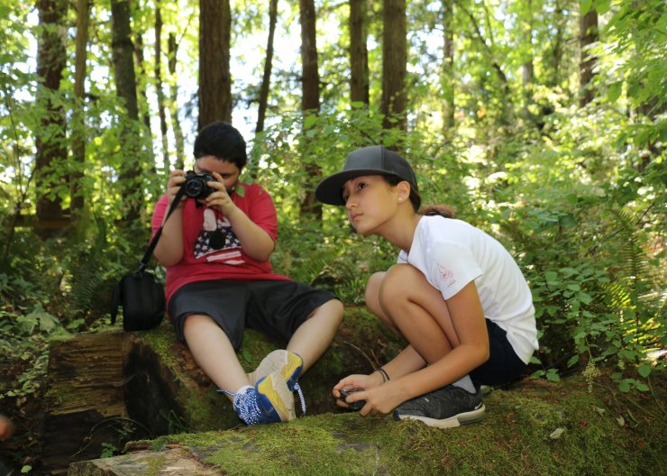 Kids taking photos of nature at Saturday Academy camp