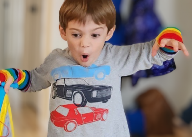 A young Saturday Academy camper is ready for imaginary play
