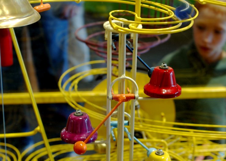 Students viewing a Rube Goldberg Machine in a Saturday Academy summer camp Grade school students viewing a spiral-shaped Rube Goldberg Machine in a Saturday Academy summer camp