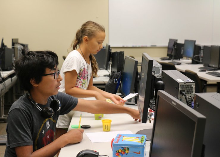 Animation Adventure; Saturday Academy STEM animation camp; Two students working on animation project together