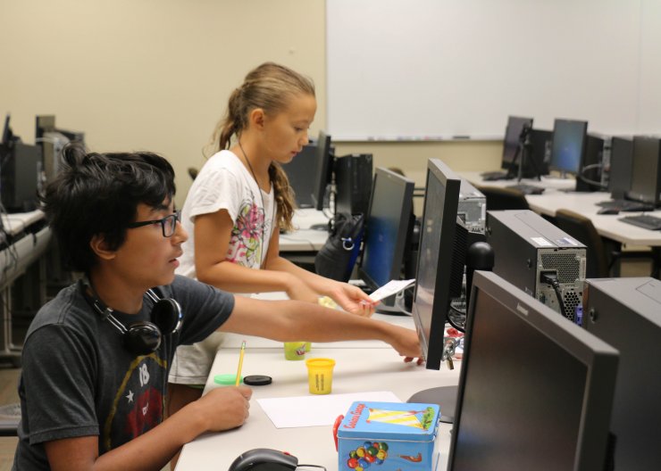 Animation Adventure Animation Adventure; Saturday Academy STEM animation camp; Two students working on animation project together