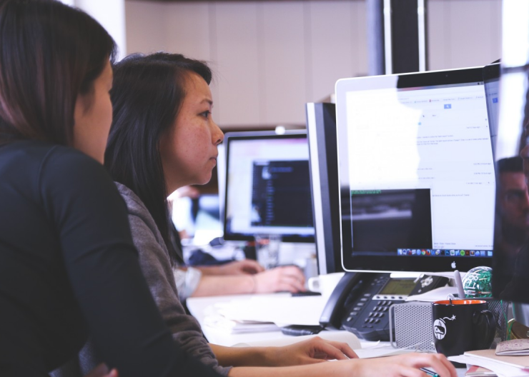 STEM Career Exploration: The World of Tech at Puppet Working at computers in a modern tech workplace