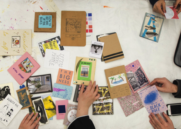 Students viewing zines in a Saturday Academy class