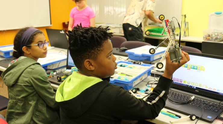 Students working with LEGOs in a Saturday Academy camp