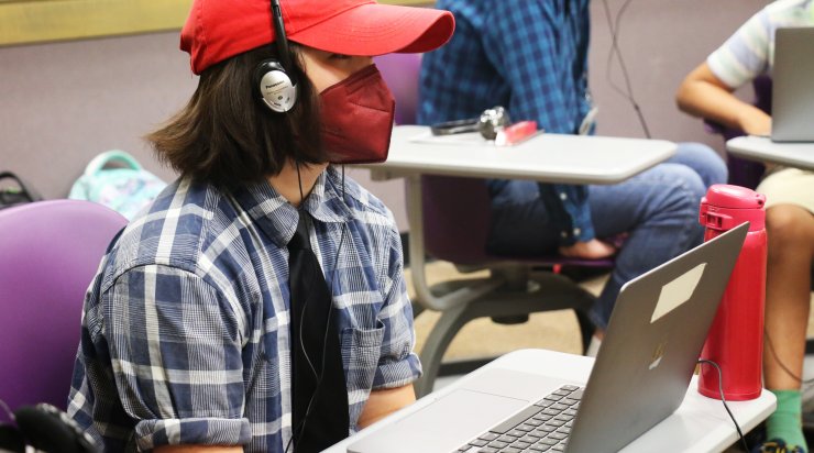 Student in a Saturday Academy summer camp working on developing music for an movie & music making project