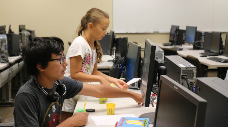 Animation Adventure; Saturday Academy STEM animation camp; Two students working on animation project together