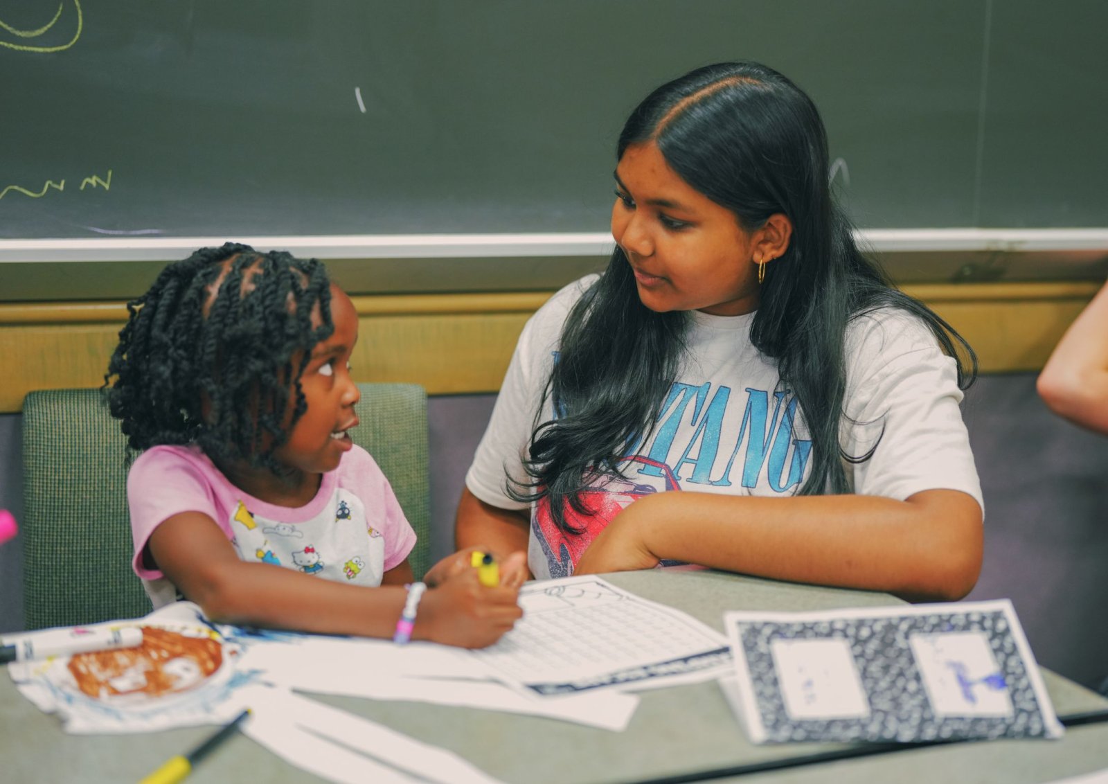 Educator helping a camper