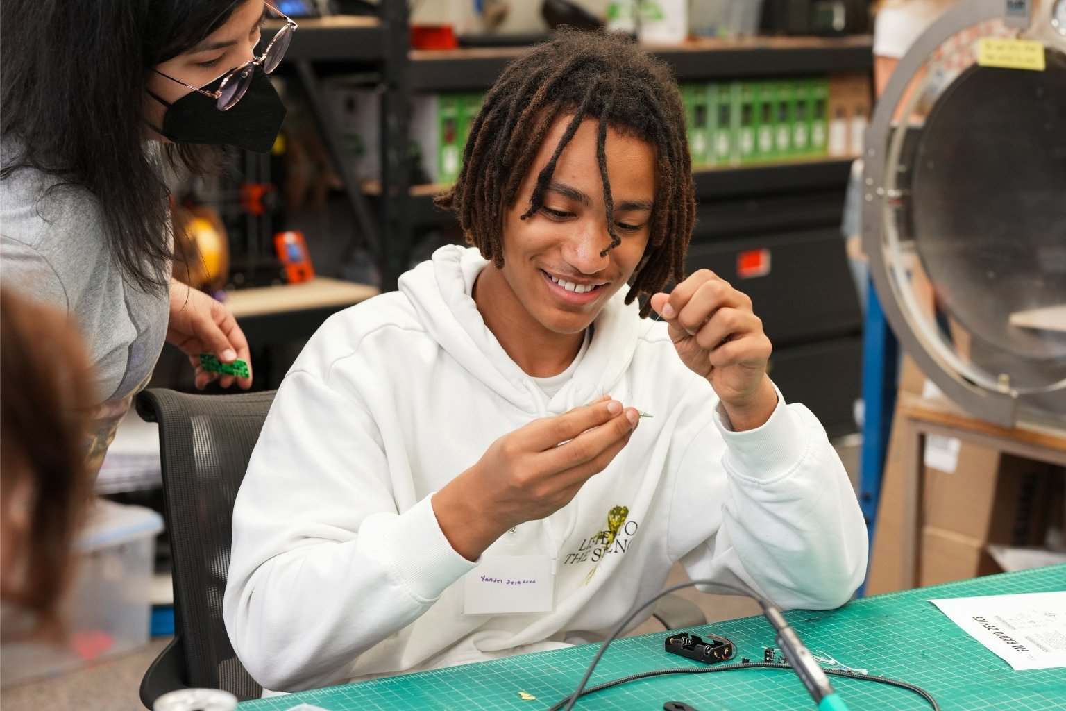 Days Off student, at Portland State University, in a soldering workshop