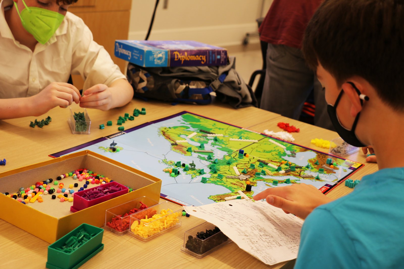 Two young students play test a board game in Saturday Academy’s Gamemaster summer camp