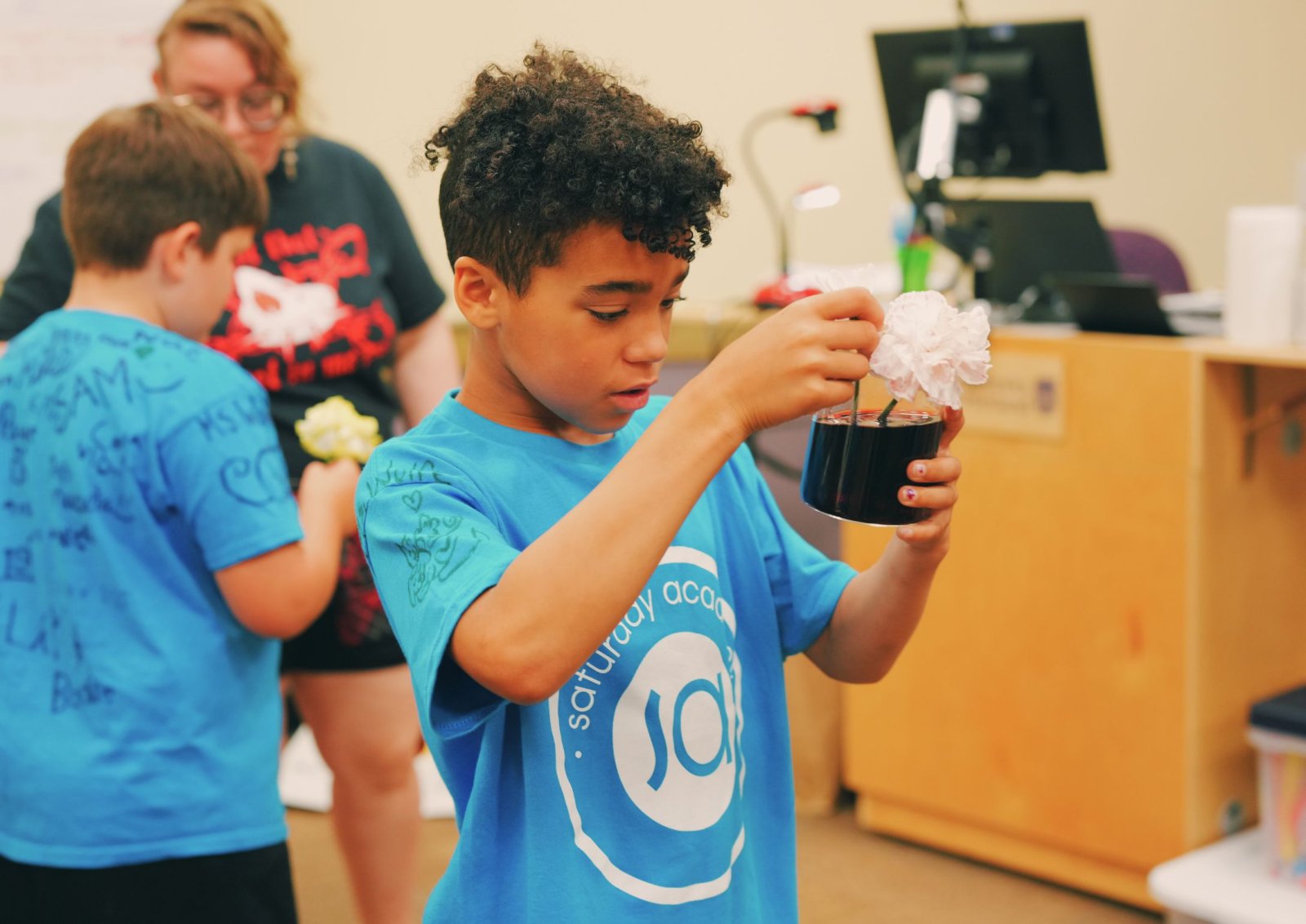 Camper observing flower experiment
