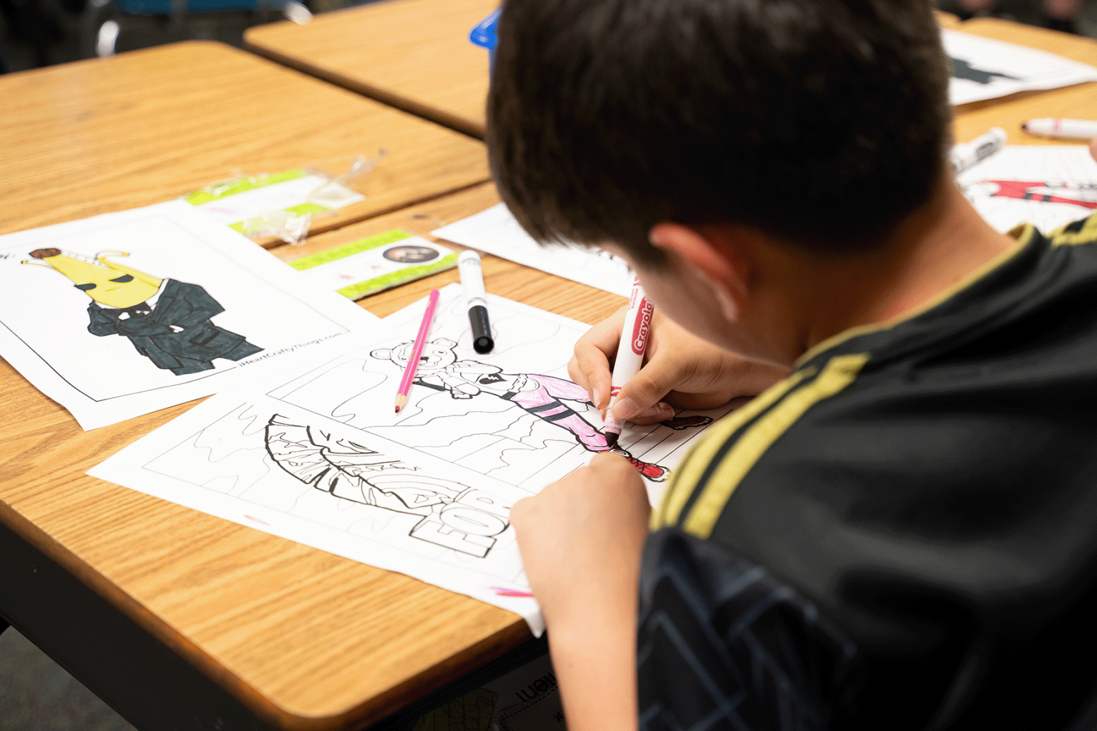 Student coloring at school residency