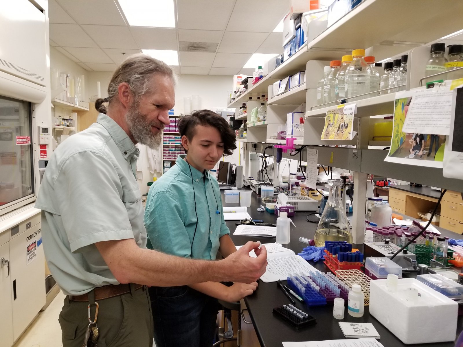 ASE intern working with their mentor in a lab