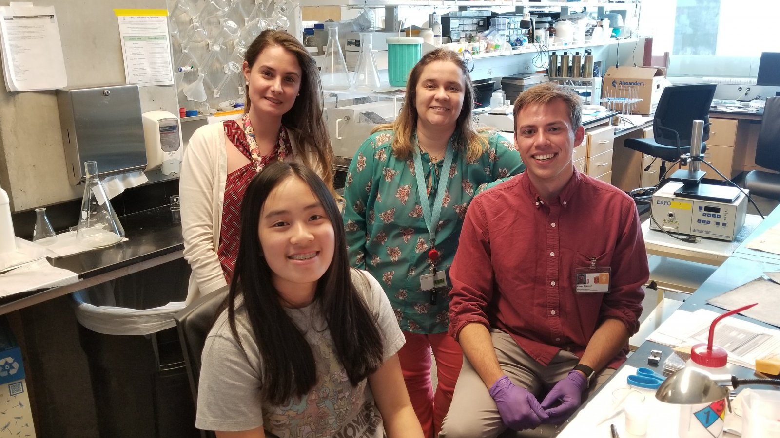 Saturday Academy ASE interns in an office setting with their mentor